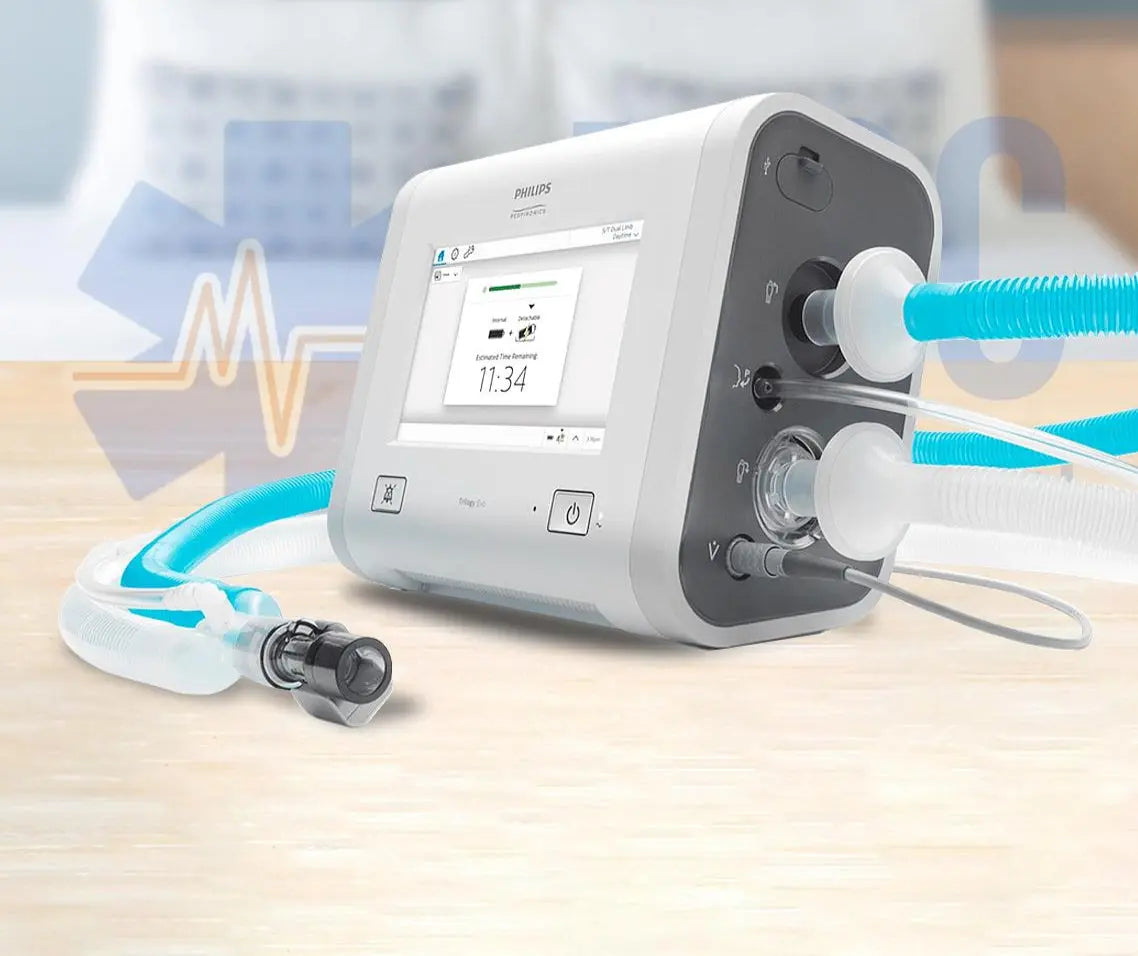 Philips Trilogy Evo Portable hospital-to-home ventilator with hoses on a white background