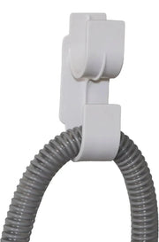 White hose holder with a coiled gray hose on a white background