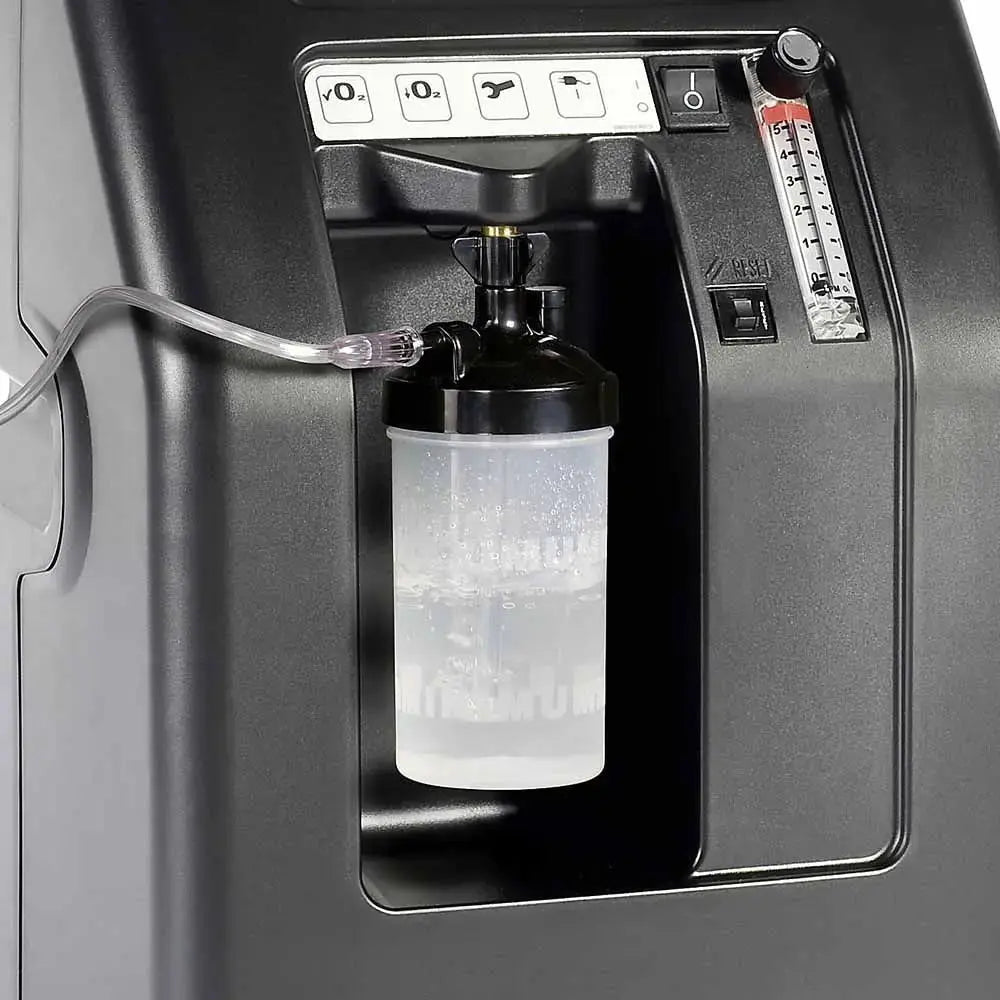 Oxygen concentrator with a bottle attached, showing the interface and controls.