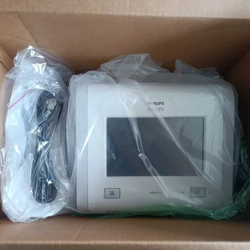 Philips Trilogy Evo Portable hospital-to-home ventilator inside a cardboard box with plastic wrap