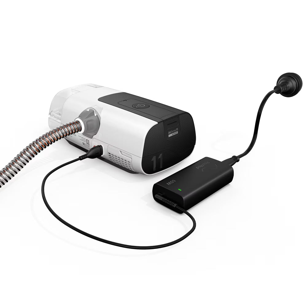 ResMed AirSense 11 CPAP machine with accessories on white background