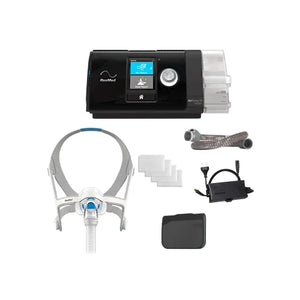 ResMed CPAP machine with accessories on a white background